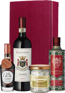 Schlaraffenland Präsent Geschenkset mit Chianti Rufina Wein, nativem Olivenöl extra, Balsamico di Modena und Gourmetsalz vor einer roten Box.