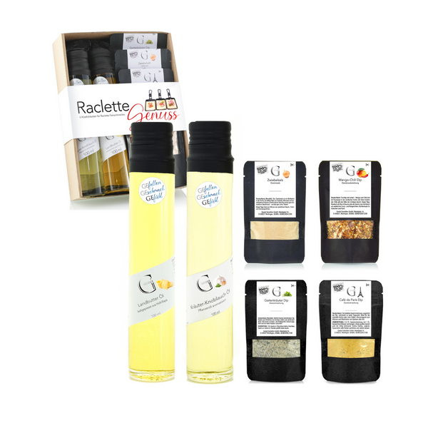 Das Geschenkset „Raclette-Genuss“ enthält zwei Flaschen Öl und vier Dip-Gewürzpäckchen, verpackt in einer transparenten Box.