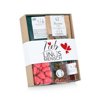 Geschenk-Set Lieblingsmensch S: Geschenkbox mit Snacks, Bonbons, Tee und Granatapfel Balsam. Mit „Lieblingsmensch“-Schriftzug und roter Herzgrafik auf der Verpackung – eine perfekte Überraschung für einen besonderen Menschen.