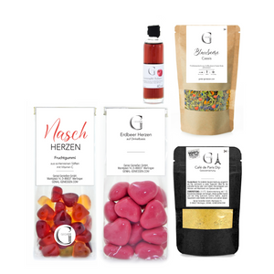 Das Geschenk-Set Lieblingsmensch S enthält Gourmet-Snacks und Gewürze – wie Café de Paris und Granatapfel Balsam – in Klarsicht- und Kraftverpackungen mit weißen Etiketten. Ideal als stilvolle Geschenkverpackung für jeden Anlass.