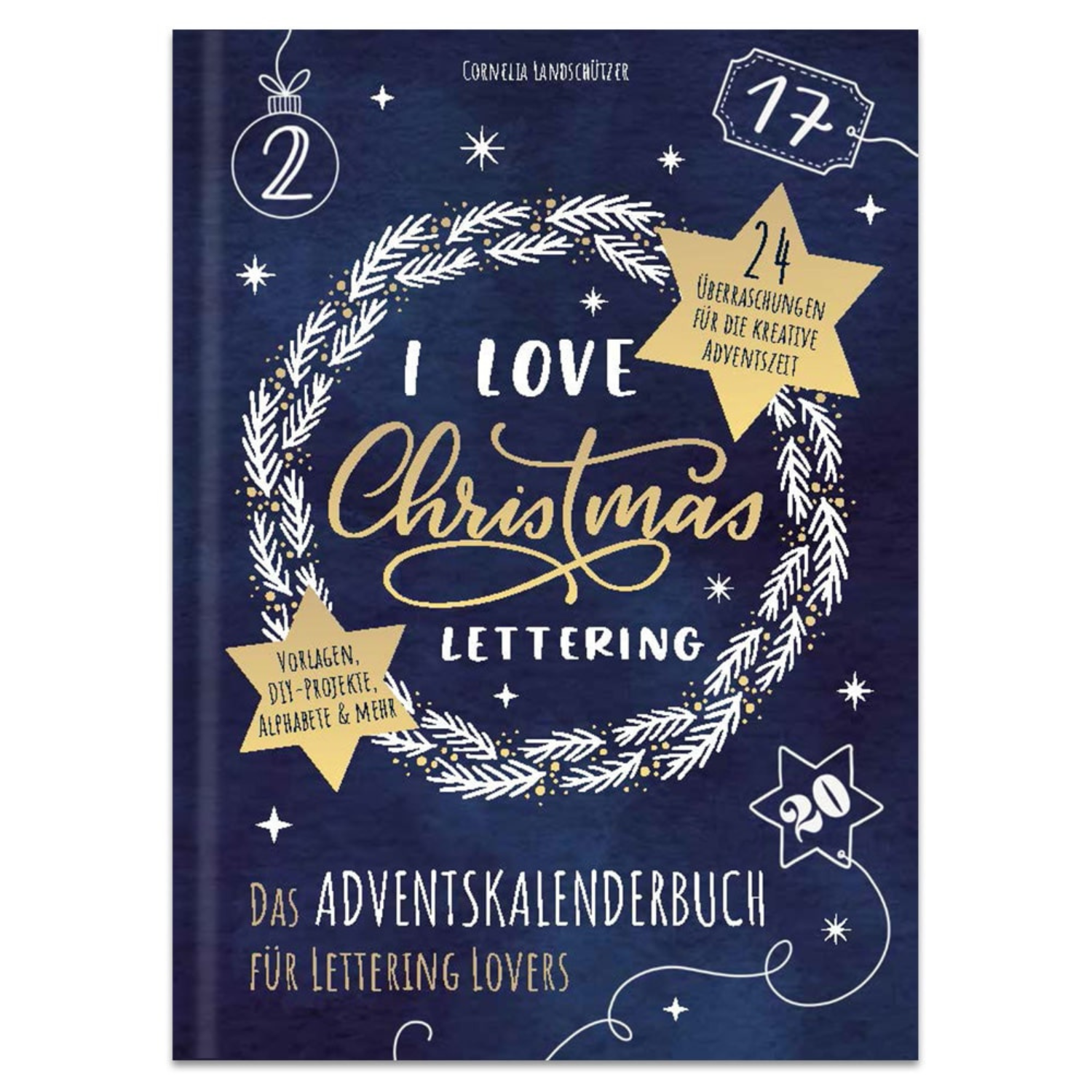 Buchcover mit weißem Kranz und goldener Handschrift auf dunkelblauem Grund. I Love Christmas Lettering – Das Adventskalenderbuch für Lettering Lovers: das perfekte Geschenk für jeden Weihnachtsfan!.