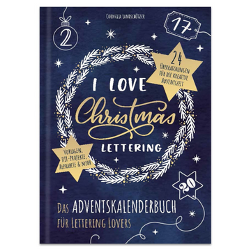 Buchcover mit weißem Kranz und goldener Handschrift auf dunkelblauem Grund. I Love Christmas Lettering – Das Adventskalenderbuch für Lettering Lovers: das perfekte Geschenk für jeden Weihnachtsfan!.