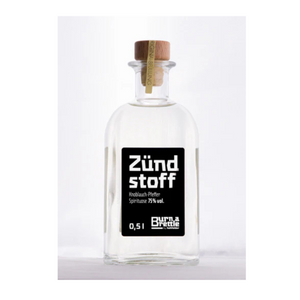 Brettle anzünden Zündstoff: 0,5L Klarglasflasche mit Holzkorken, Aufschrift Zündstoff, enthält 75% Spiritus – ideal zum Anzünden eines Brettle oder zum Genießen in verschiedenen Geschmacksrichtungen.